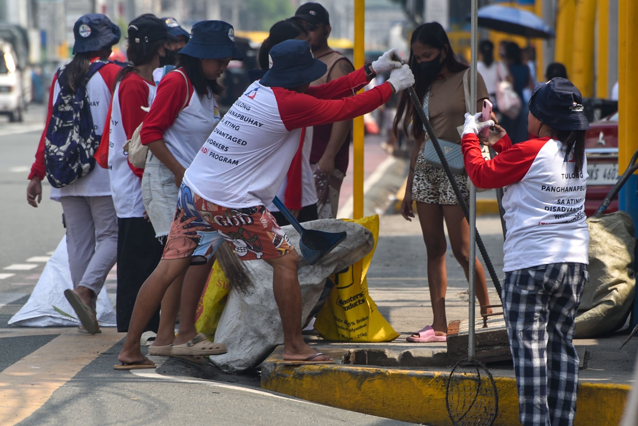 TUPAD workers clearing debris in drainage system in Cavite