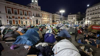 DEMONSTRATORS wake up as they camp one day after a protest against evictions and the housing crisis in front of the Presidency of the Community of Madrid on the Puerta del Sol plaza in Madrid, Spain on 27 September 2026.