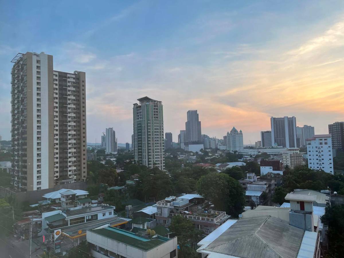 HIGH-RISES now tower above the houses and trees of present-day Lahug, Cebu City.