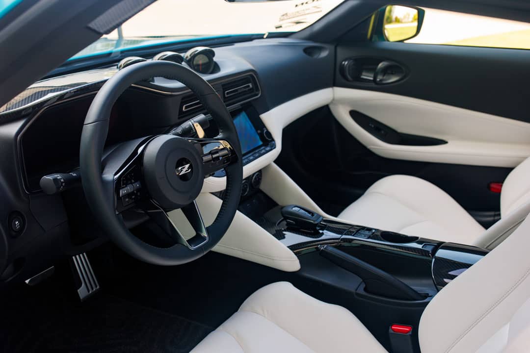 WHITE leather-appointed seats and carbon-fiber trim give the Z Kaze cabin a brighter look that suits its removable roof panels.