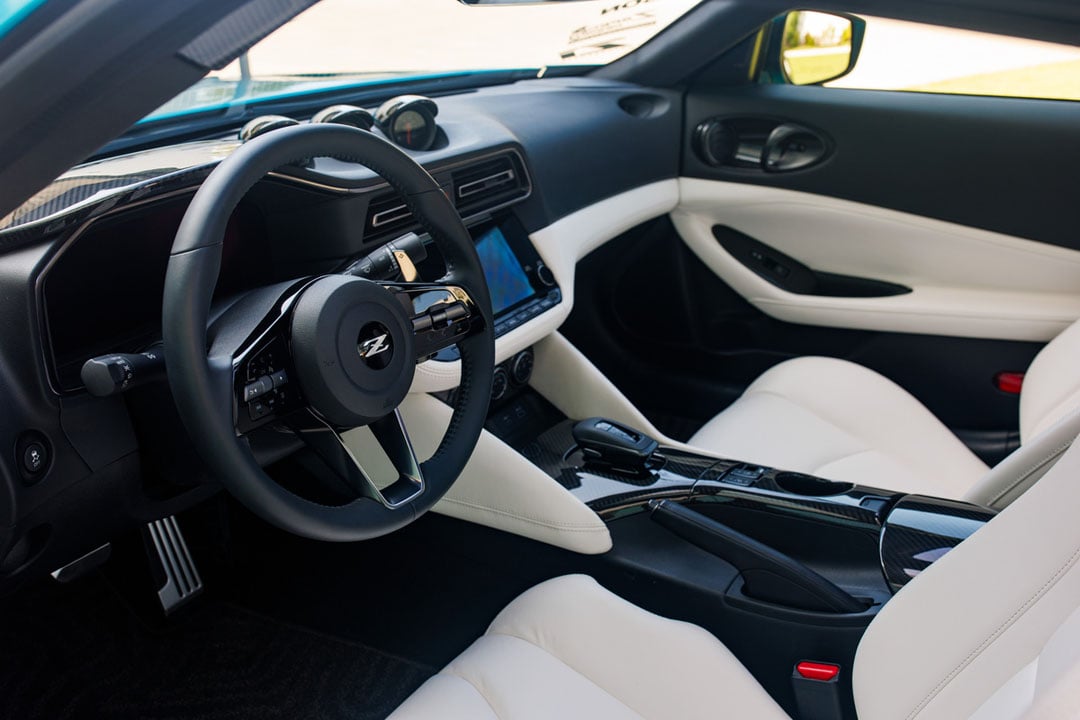 WHITE leather-appointed seats and carbon-fiber trim give the Z Kaze cabin a brighter look that suits its removable roof panels.