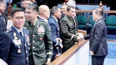 SENATOR Christopher 'Bong' Go (right) shakes hands with senior officers from the Armed Forces of the Philippines during the Commission on Appointments hearing recently.
