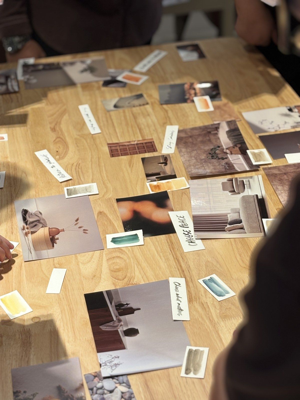 A SELECTION of images, textures and color swatches is laid out on a table.
