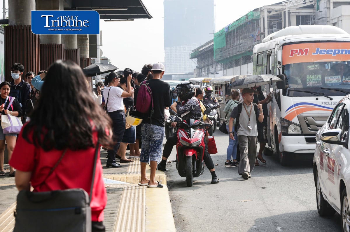 Commuters wait for public transportation at Philcoa along Commonwealth Avenue in Quezon City on Monday, 28 September 2026, amid a transport strike. | Analy Labor