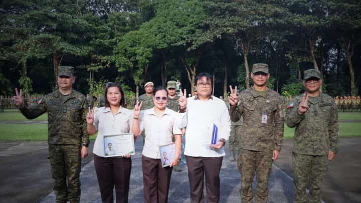 2nd Infantry Division civilian personnel pose with Philippine Army officials after receiving service and professional development awards at Camp Capinpin in Tanay, Rizal, on Sept. 28, 2026.