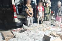 POLICE officers inspect master cases of alleged smuggled cigarettes valued at P1.08 million following a highway checkpoint operation in Kapatagan, Lanao del Norte, on Tuesday.