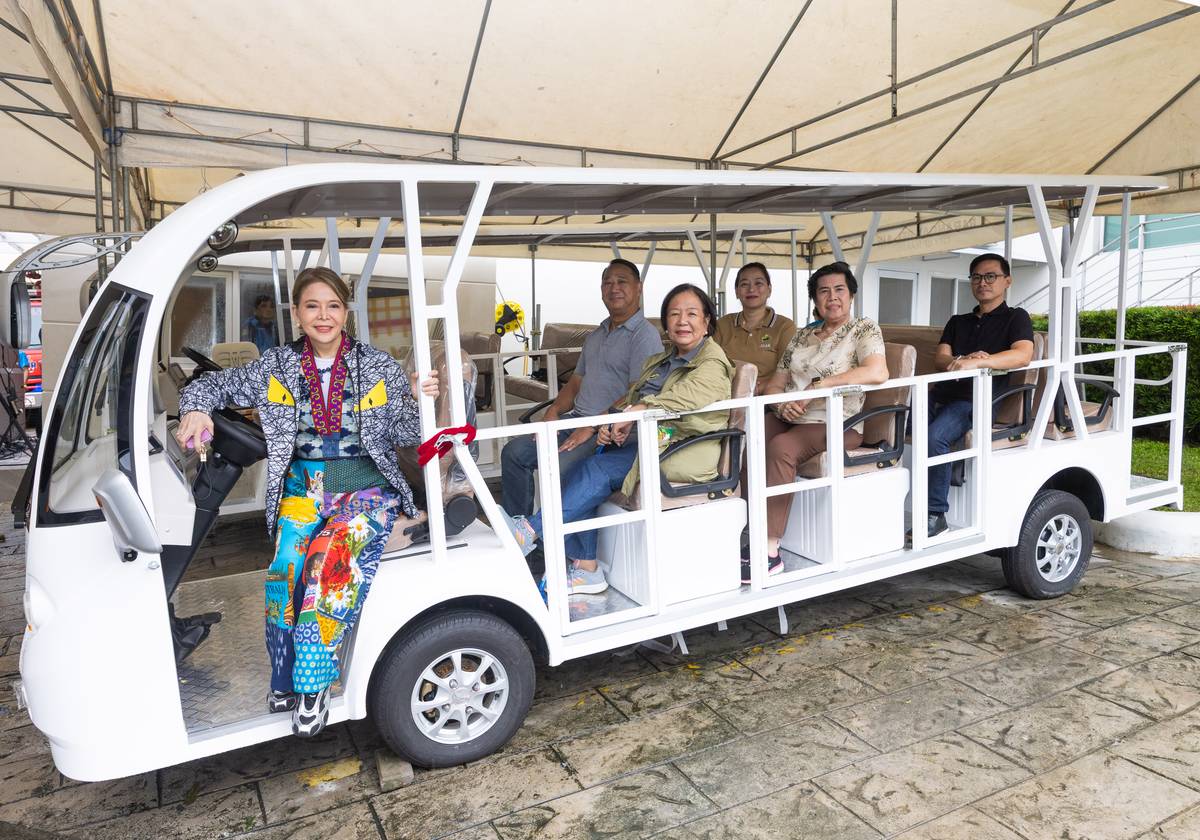 WITH the electric shuttles from Movem Electric Inc., residents of Barangay Bel-Air in Makati City now have free access to cleaner and quieter transportation within the community. In photo are Barangay Bel-Air captain Cynthia Cervantes (left) with residents.
