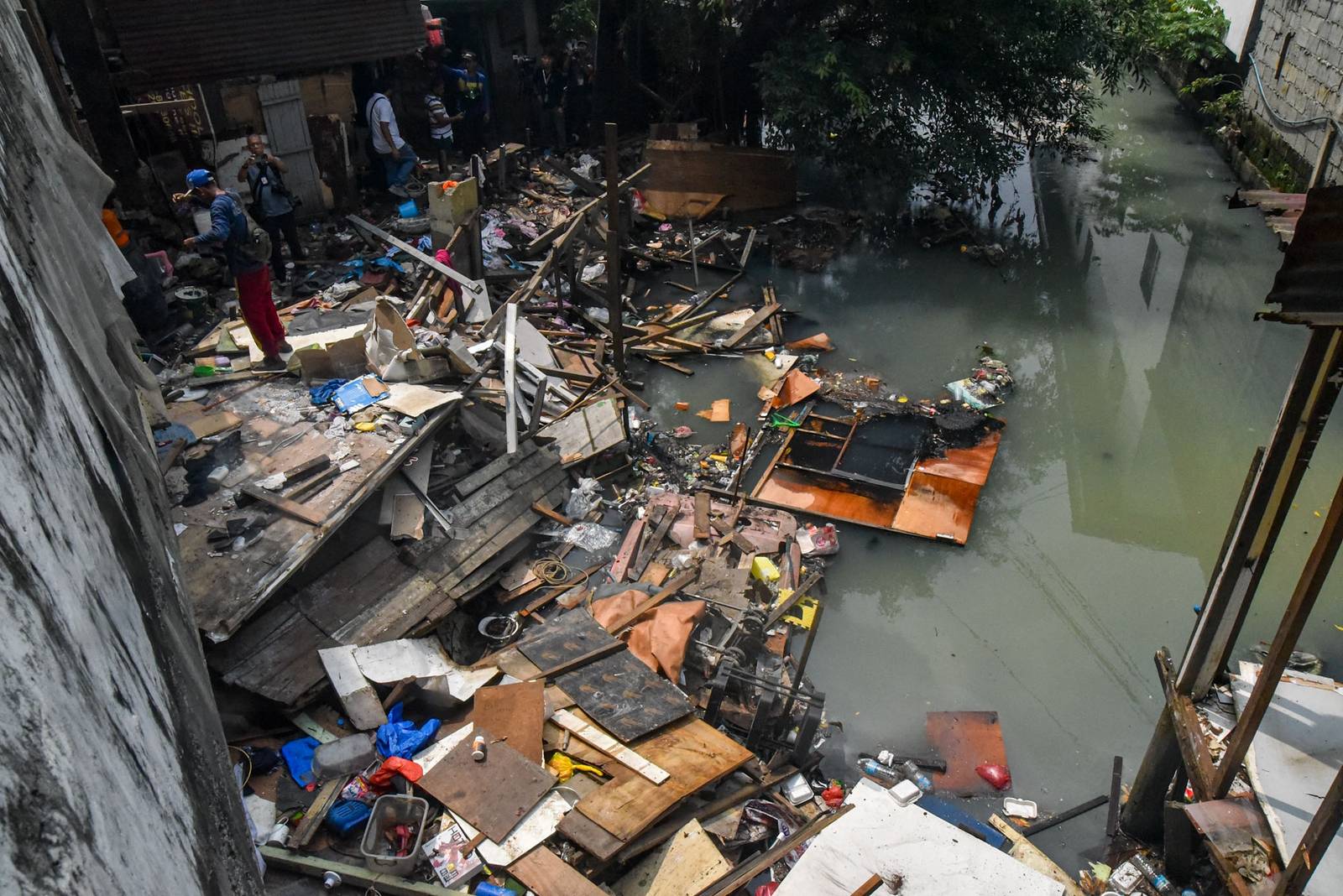 Homes of 49 families who live under the Osmeña Tunnel are demolished by personnel from the Department of Public Works and Highways (DPWH) in Malate, Manila, on September 30.

For years, the families made the space beneath the tunnel, extending to Barangays 738 and 799, their home, turning the cramped area into living spaces while carrying on with their livelihoods. The families will be relocated to San Ildefonso, Bulacan, where they face the challenge of adjusting to a new environment and lifestyle. | Zedrich Xylak Madrid