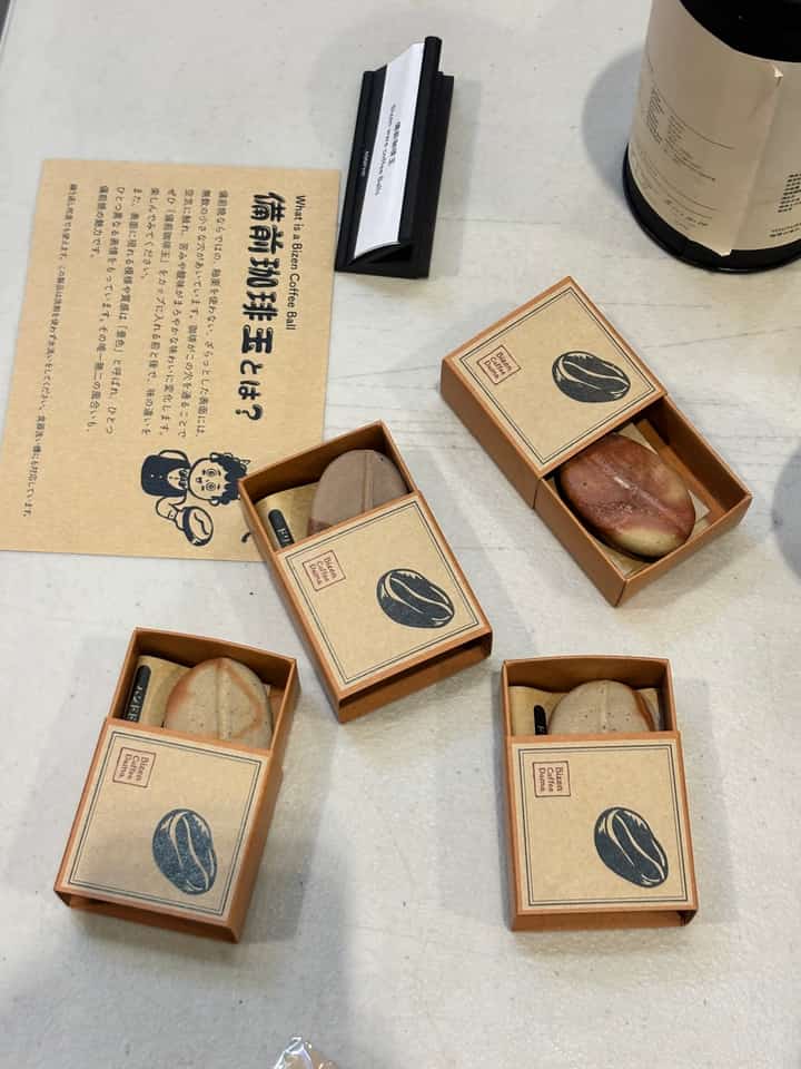 BIZEN Ware Coffee Ball, an unglazed, bean-shaped Japanese ceramic placed inside a coffee mug to soften acidity and smooth out harsh flavors.
