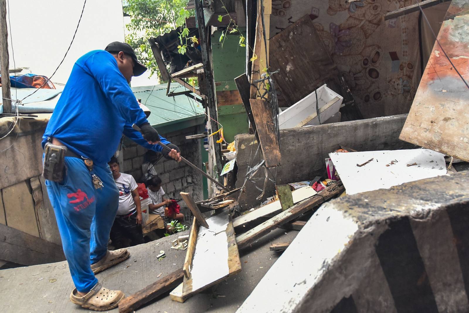Homes of 49 families who live under the Osmeña Tunnel are demolished by personnel from the Department of Public Works and Highways (DPWH) in Malate, Manila, on September 30.

For years, the families made the space beneath the tunnel, extending to Barangays 738 and 799, their home, turning the cramped area into living spaces while carrying on with their livelihoods. The families will be relocated to San Ildefonso, Bulacan, where they face the challenge of adjusting to a new environment and lifestyle. | Zedrich Xylak Madrid