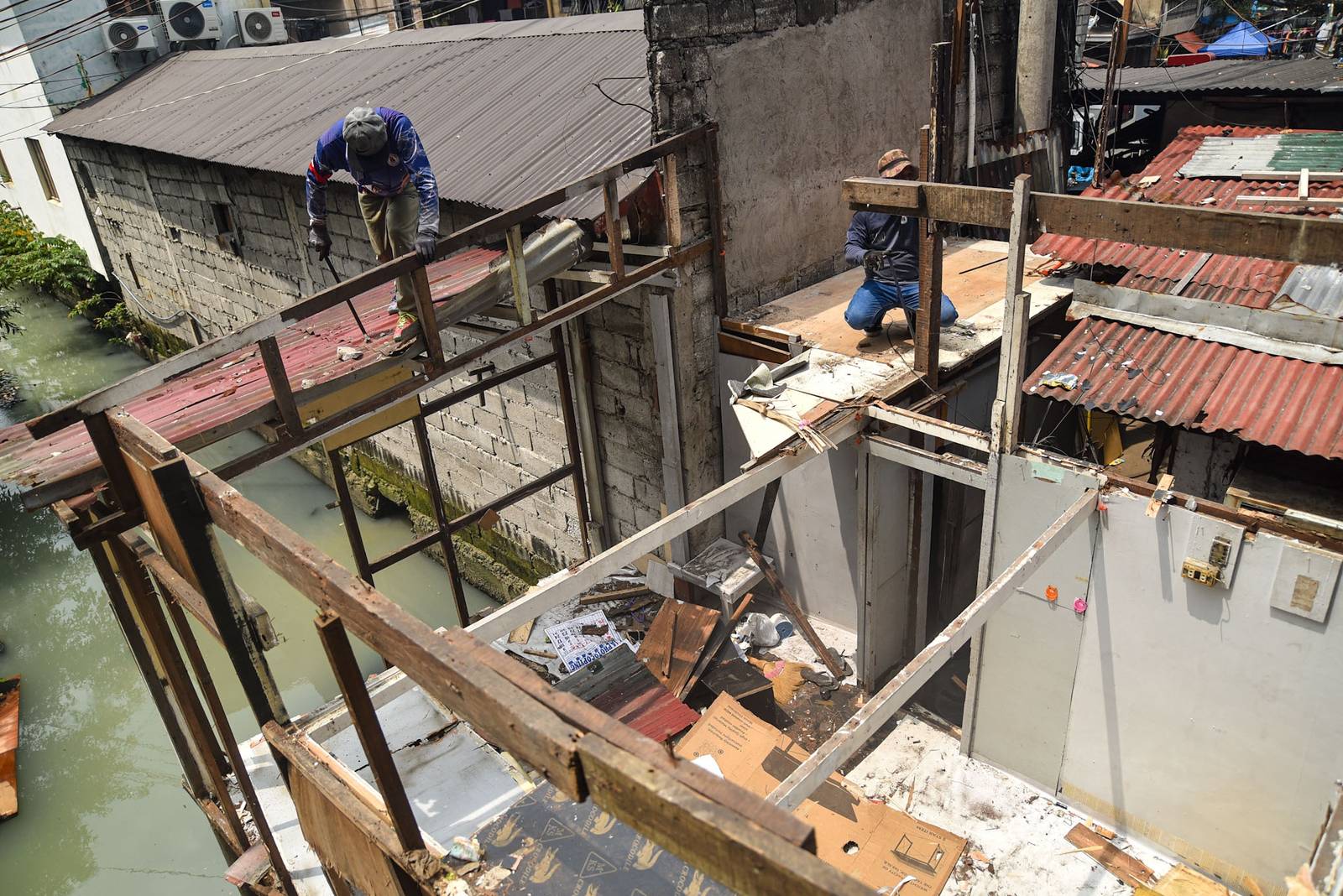 Homes of 49 families who live under the Osmeña Tunnel are demolished by personnel from the Department of Public Works and Highways (DPWH) in Malate, Manila, on September 30.

For years, the families made the space beneath the tunnel, extending to Barangays 738 and 799, their home, turning the cramped area into living spaces while carrying on with their livelihoods. The families will be relocated to San Ildefonso, Bulacan, where they face the challenge of adjusting to a new environment and lifestyle. | Zedrich Xylak Madrid