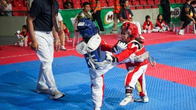 A young taekwondo jin (left) executes a front-leg kick to his opponent ahead of the staging of the 2026 MILO National Taekwondo Championships this October.