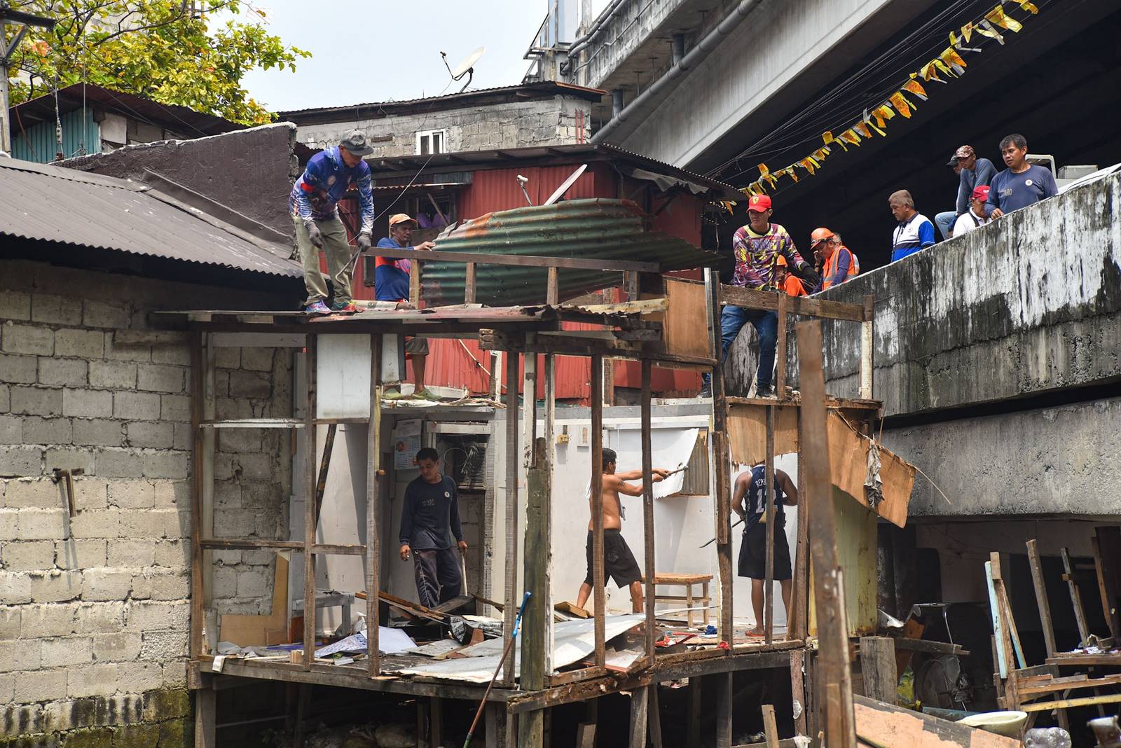 Homes of 49 families who live under the Osmeña Tunnel are demolished by personnel from the Department of Public Works and Highways (DPWH) in Malate, Manila, on September 30.

For years, the families made the space beneath the tunnel, extending to Barangays 738 and 799, their home, turning the cramped area into living spaces while carrying on with their livelihoods. The families will be relocated to San Ildefonso, Bulacan, where they face the challenge of adjusting to a new environment and lifestyle. | Zedrich Xylak Madrid