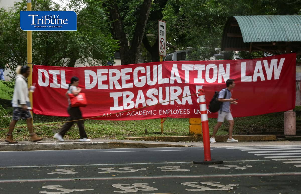 JUNK OIL DEREGULATION LAW
A protest banner calling for the junking of the Oil Deregulation Law hangs inside the University of the Philippines Diliman campus in Quezon City on Thursday, 1 October 2026. | Analy Labor