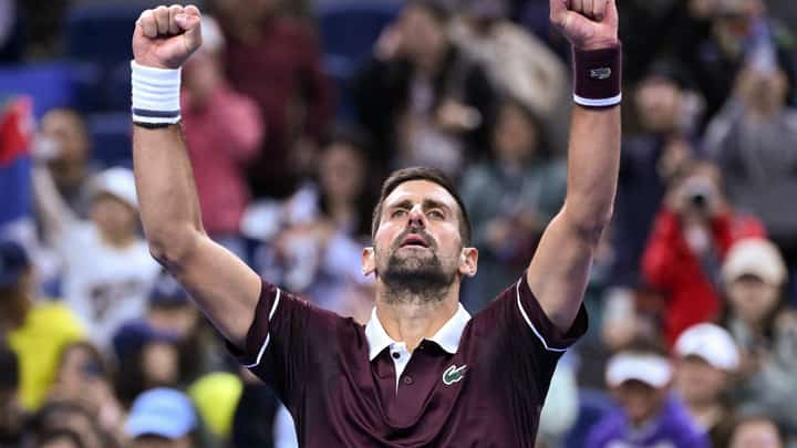 Serbia's Novak Djokovic reacts after his victory against Portugal's Nuno Borges during their men's singles first round match at the China Open tennis tournament in Beijing on 30 September 2026.
