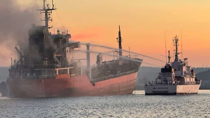 PHILIPPINE Coast Guard personnel, Bureau of Fire Protection firefighters and local tugboat crews respond to a fire onboard the molasses-laden motor tanker MTKR Gindara at the Balayan Distillery Inc. Port in Calaca City, Batangas.