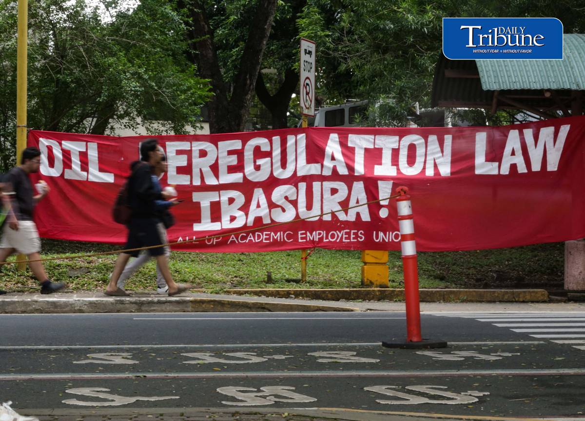 JUNK OIL DEREGULATION LAW
A protest banner calling for the junking of the Oil Deregulation Law hangs inside the University of the Philippines Diliman campus in Quezon City on Thursday, 1 October 2026. | Analy Labor