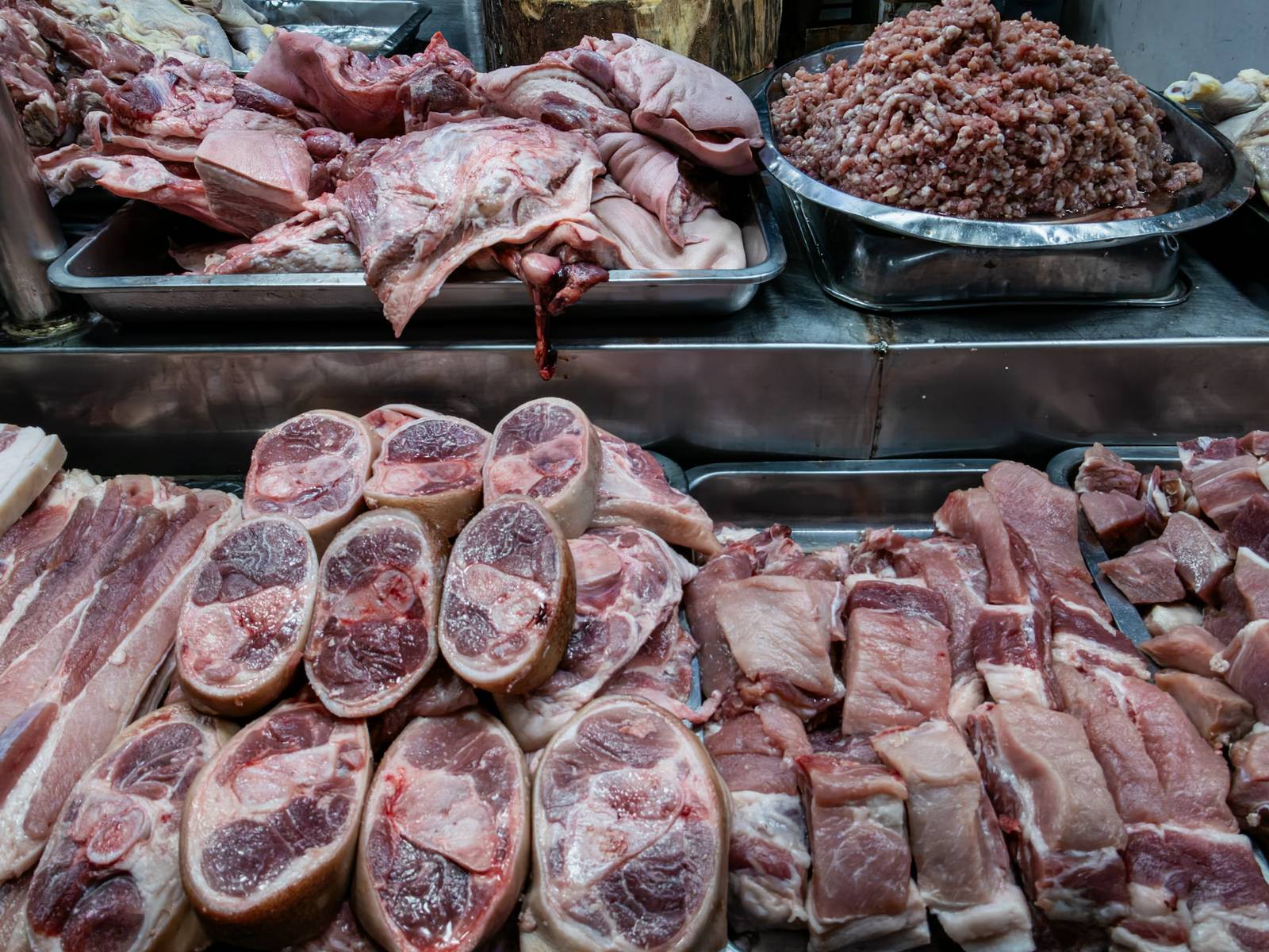 Pork cuts are displayed for sale at Paco Public Market in Manila on 02 October 2026. The Department of Agriculture is proposing higher pork import tariffs in 2027 as local hog production recovers and farmgate prices fall.