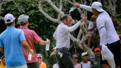 JHONNEL Ababa gets drenched by teammates in celebration after his dramatic victory in the ICTSI Iloilo Golf Challenge on Friday.