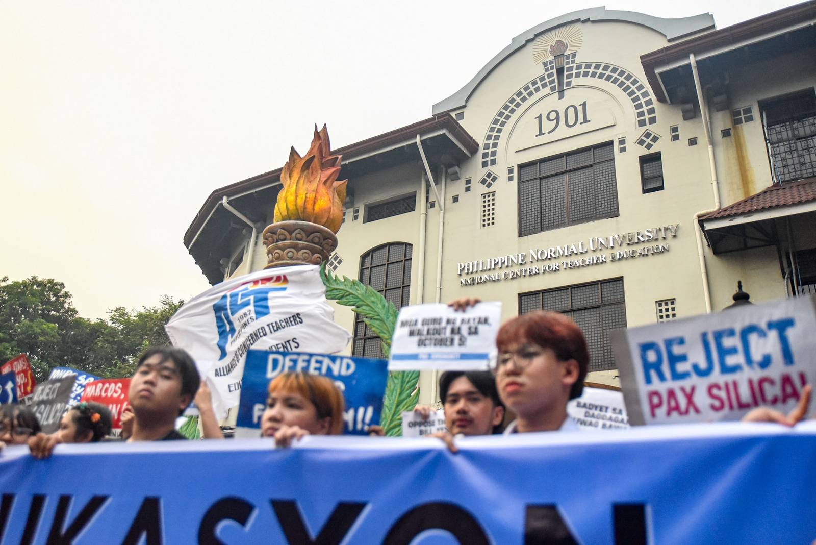 Student-teachers from progressive groups at the Philippine Normal University (PNU) call on the university administration and the Marcos Jr. government to provide livable wages for teachers and oppose budget cuts that they say affect student welfare during a protest in Manila on October 2.

The student-teachers are set to hold a walkout on October 5 in observance of World Teachers’ Day. l Zedrich Xylak Madrid