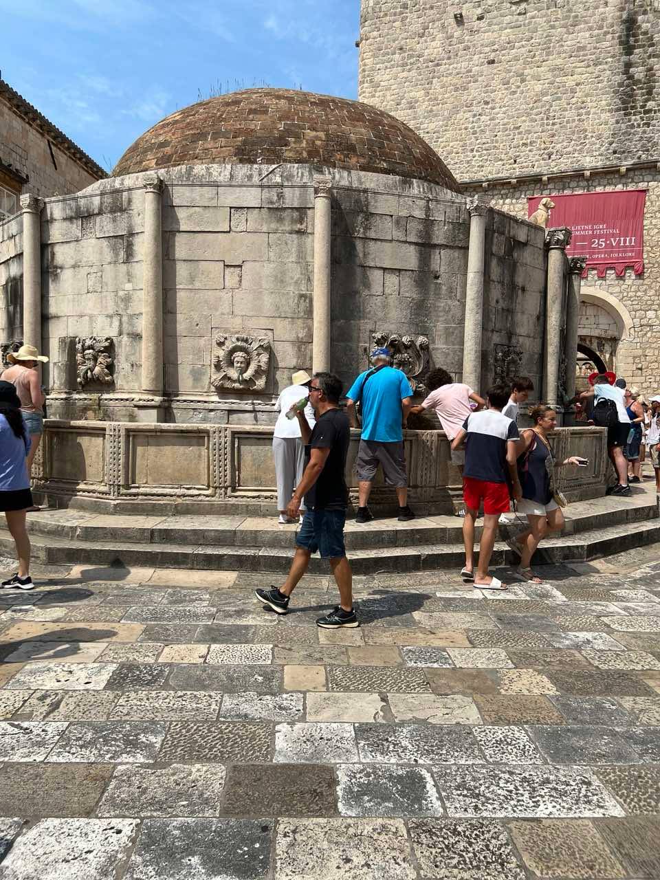 A CROWD gathers around The Large Onofrio’s Fountain to cool down.