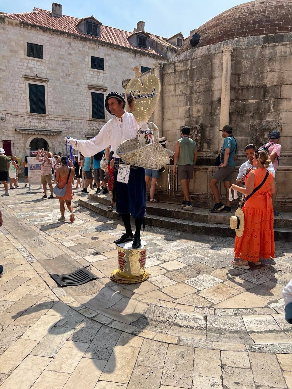 A STREET performer spreads positive energy with a Heart for Love sign.