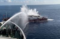 TAIWAN's Coast Guard uses a water cannon to drive off the Chinese fishing boat Jin Sha after it refused orders to leave restricted waters near Taiwan-held Dongsha Island.