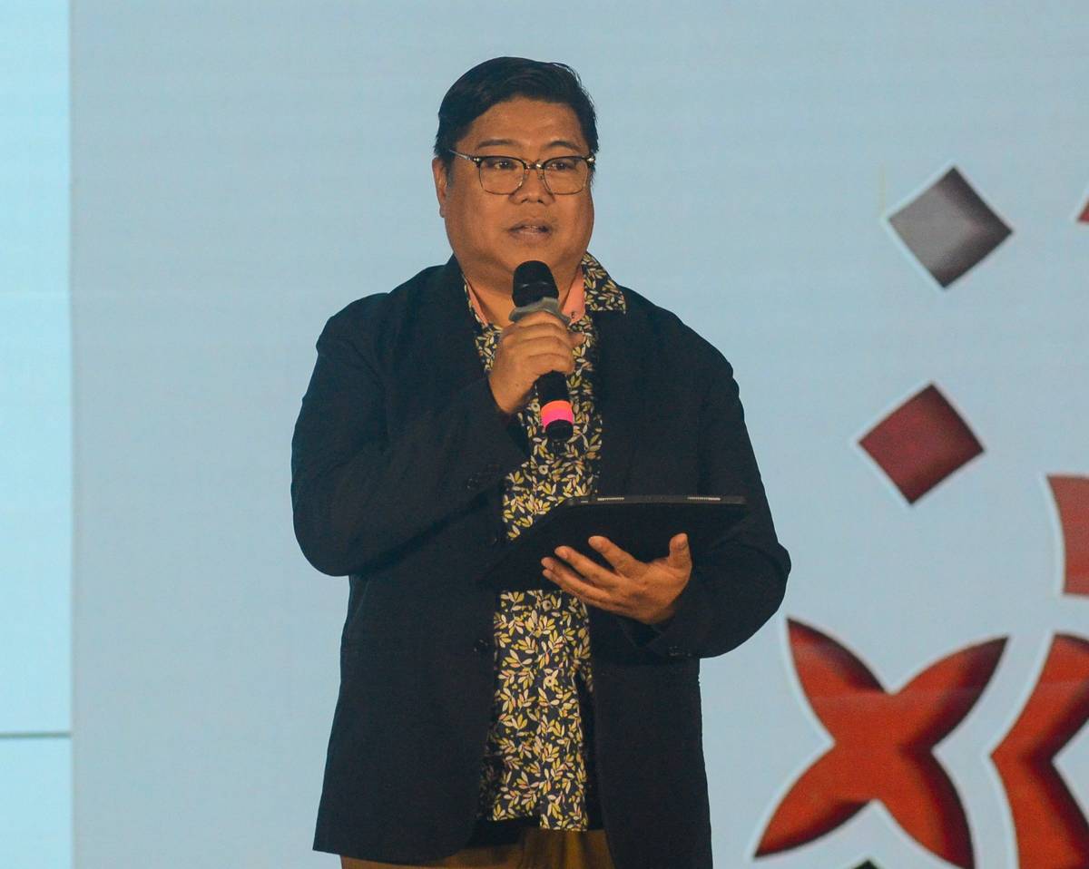 THE Madrigal Singers conductor Mark Anthony Carpio delivers the opening remarks.
