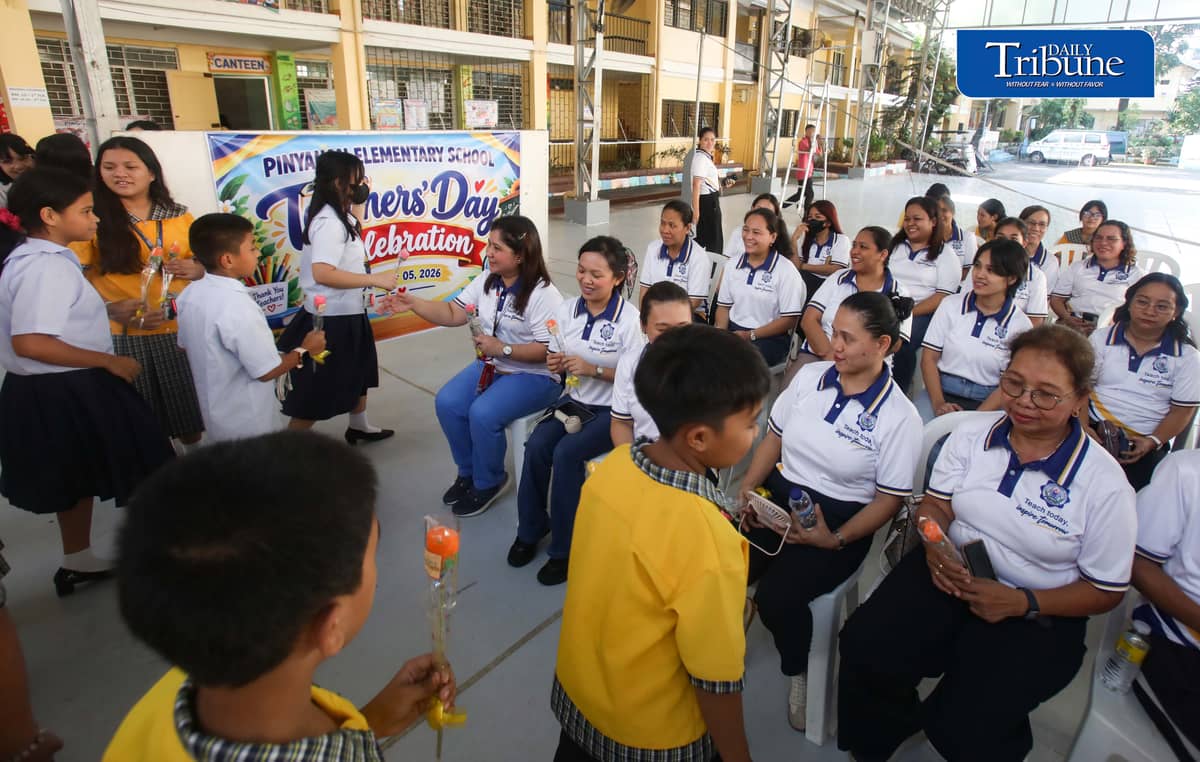 (October 05 2026) The students at Pinyahan Elementary School in Quezon City, gave flowers to their teachers to express their gratitude for their teaching and care while at the school, as they celebrate the National and World Teachers' Day on Monday October 5 2026. Photo/Analy Labor