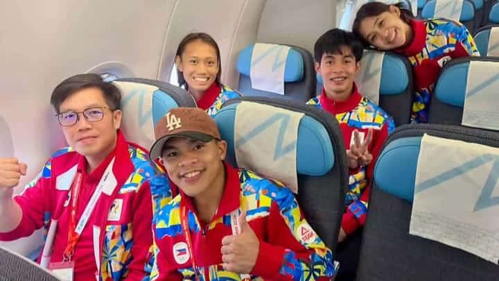 MEDALISTS Carlo Paalam of boxing (front row, right), Jeus Yape (second row, right), Tachiana Mangin (second row, left) and Juliana Candelaria (third row) of taekwondo are part of the last batch of Filipino athletes who flew out of Nagoya following a successful stint in the 20th Asian Games. Also shown is POC officer Raymund Flores.