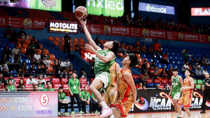 JHOMEL Ancheta of Saint Benilde scores on a drive as the Blazers roll past the San Sebastian Stags, 73-66, in the NCAA Season 102 men’s basketball tournament.