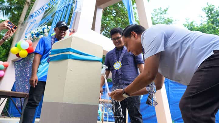 Proof at the Tap. Governor Arthur Defensor Jr. samples the water from the newly inaugurated P4-million system in Barangay Tapikan, San Joaquin, highlighting the project’s service to the community