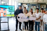 VILLAR Group chairman Manny Villar hands over the symbolic key to a new home to the five children of the late OFW Baby Jane Teodoro Allas and their grandmother. The house and lot, donated through Vista Land, gives the siblings a secure home following the loss of their mother, who worked in Hong Kong to provide for her family.
