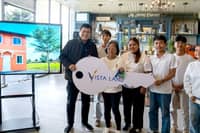 VILLAR Group chairman Manny Villar hands over the symbolic key to a new home to the five children of the late OFW Baby Jane Teodoro Allas and their grandmother. The house and lot, donated through Vista Land, gives the siblings a secure home following the loss of their mother, who worked in Hong Kong to provide for her family.