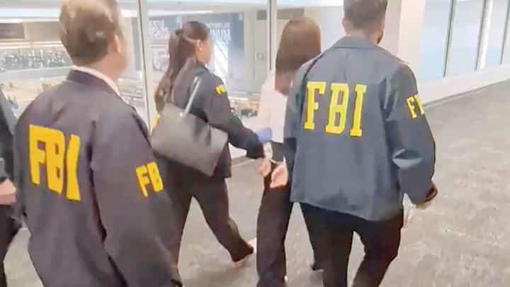 FEDERAL Bureau of Investigation agents accost Wanying Zhang (2nd from right) who was arrested at the Los Angeles airport in California.