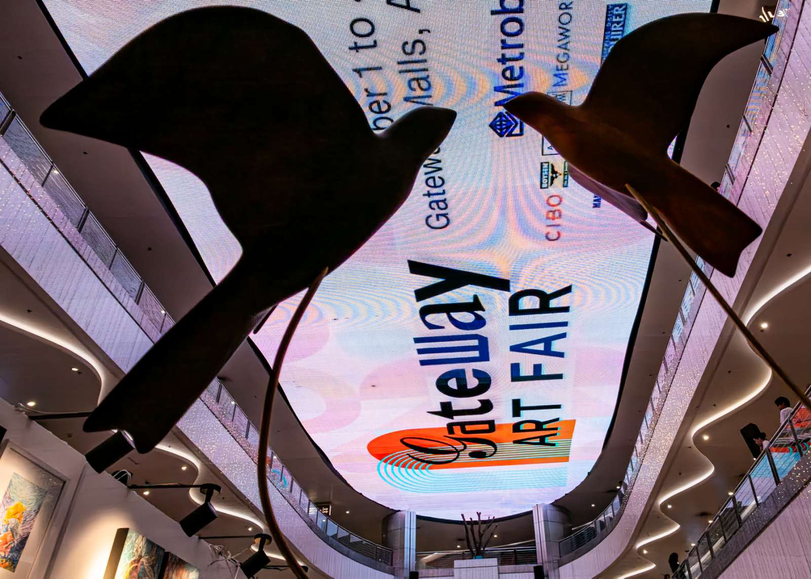 LARGE bird sculptures hang above the atrium.