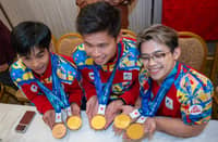JEUS Yape of taekwondo, Ernest John Obiena of athletics and Carlos Yulo of gymnastics proudly display the gold medals they won in the 20th Asian Games during the Heroes’ Welcome on Monday night.
