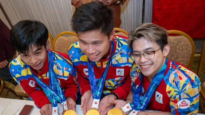 JEUS Yape of taekwondo, Ernest John Obiena of athletics and Carlos Yulo of gymnastics proudly display the gold medals they won in the 20th Asian Games during the Heroes’ Welcome on Monday night.