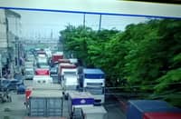 Trucks lined up at port area.