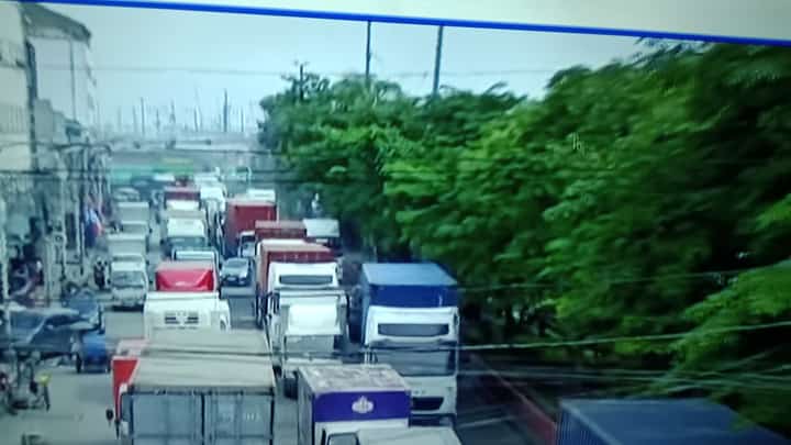 Trucks lined up at port area.