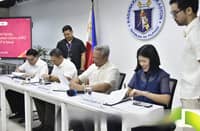 HEALTH Secretary Edwin M. Mercado (from left), Education Secretary Juan Edgardo Angara, Interior Secretary Juanito Victor Remulla and PhilHealth acting president and CEO Beverly Lorraine C. Ho sign a Joint Memorandum Circular launching the YAKAP School Health and Protection Program on Tuesday.