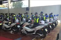 Police officers beside newly turned over Unified 911 Emergency Response Motorcycles at Camp BGen Vicente P. Lim in Calamba City.