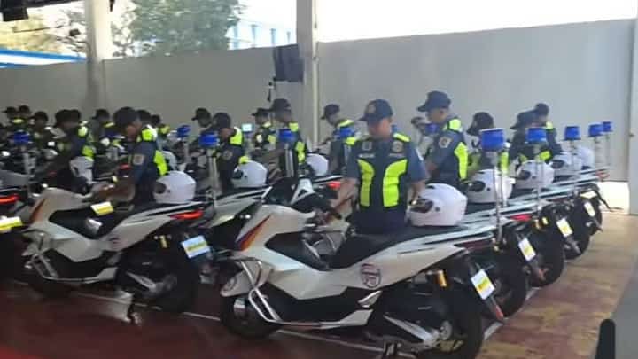 Police officers beside newly turned over Unified 911 Emergency Response Motorcycles at Camp BGen Vicente P. Lim in Calamba City.