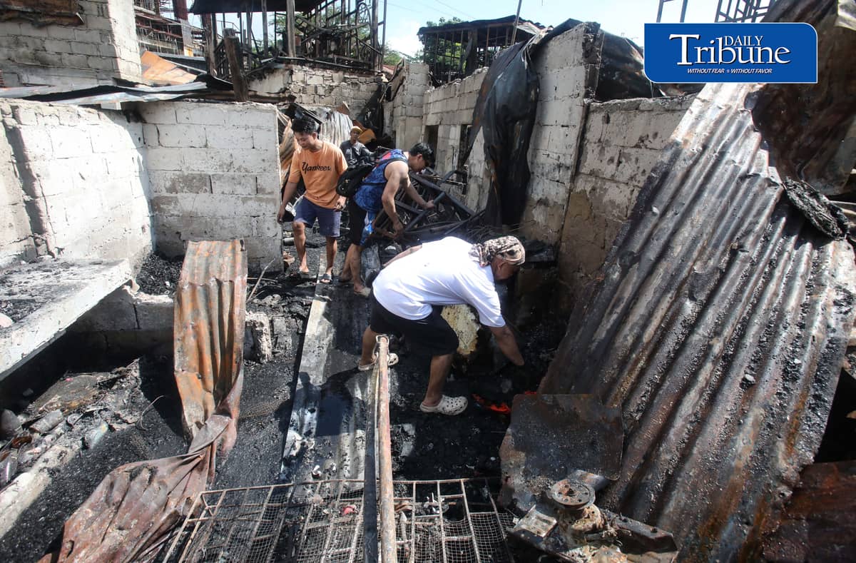 (October 07 2026) Fire victims at Waling Waling, in Brgy. Central, Quezon City on Wednesday October 7 2026, savage reusable materials lifted from the fifth alarm fire that hit in the area on Tuesday. Photo/Analy Labor