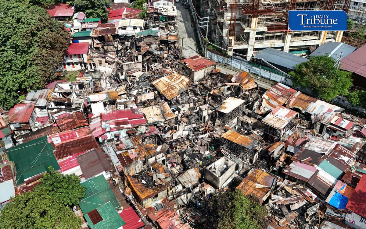 (October 07 2026) Fire victims at Waling Waling, in Brgy. Central, Quezon City on Wednesday October 7 2026, savage reusable materials lifted from the fifth alarm fire that hit in the area on Tuesday. Photo/Analy Labor