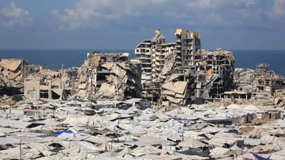 TEMPORARY tents of displaced Palestinians is pictured along destroyed buildings in Gaza City on 7 October 2026. Israel carried out new strikes in Gaza as it marked the third anniversary of the 2023 attacks by Hamas, with Palestinian officials reporting two dead.