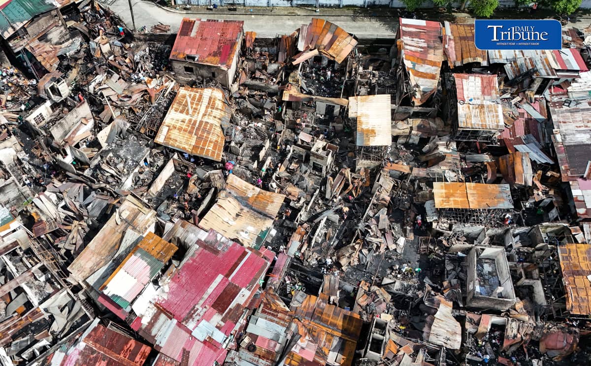 (October 07 2026) Fire victims at Waling Waling, in Brgy. Central, Quezon City on Wednesday October 7 2026, savage reusable materials lifted from the fifth alarm fire that hit in the area on Tuesday. Photo/Analy Labor