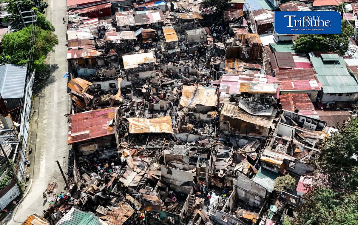 (October 07 2026) Fire victims at Waling Waling, in Brgy. Central, Quezon City on Wednesday October 7 2026, savage reusable materials lifted from the fifth alarm fire that hit in the area on Tuesday. Photo/Analy Labor