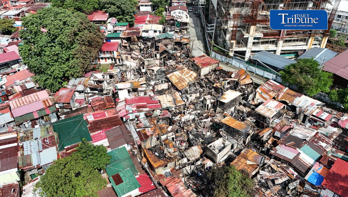 (October 07 2026) Fire victims at Waling Waling, in Brgy. Central, Quezon City on Wednesday October 7 2026, savage reusable materials lifted from the fifth alarm fire that hit in the area on Tuesday. Photo/Analy Labor