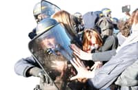 POLICE officers in riot gear scuffle with protesters as they attempt to evacuate a blockade action during a demonstration of students near Helene Boucher high school in Paris, on 8 October 2026, as part of a nationwide protest movement over learning conditions. Since late September, pupils have barred the entrances to hundreds of schools, complaining of teacher absences, overloaded timetables, dilapidated classrooms and buildings ill-adapted to rising temperatures, among other grievances.